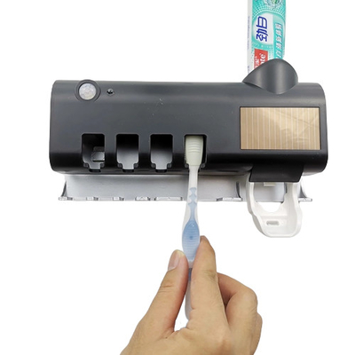 Tenedor ULTRAVIOLETA del cepillo de dientes del soporte inalámbrico de la pared de la esterilización con el soporte de vaso de cepillo